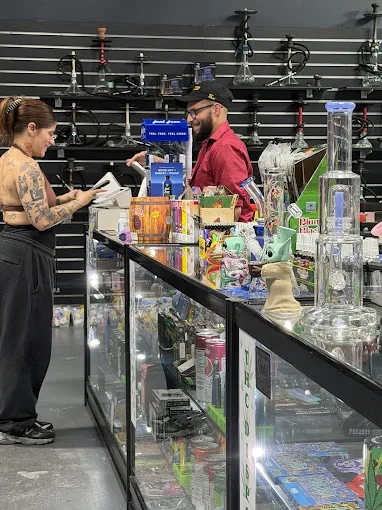 247 Smoke Shop counter where group orders are processed and confirmed.